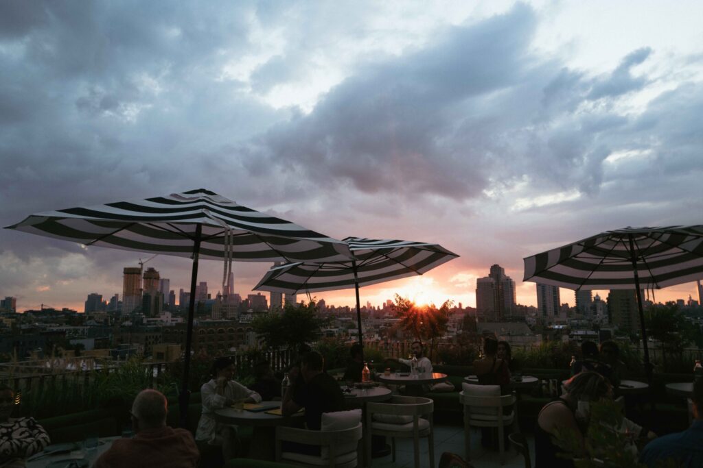 A terrace with umbrellas, tables and chairs